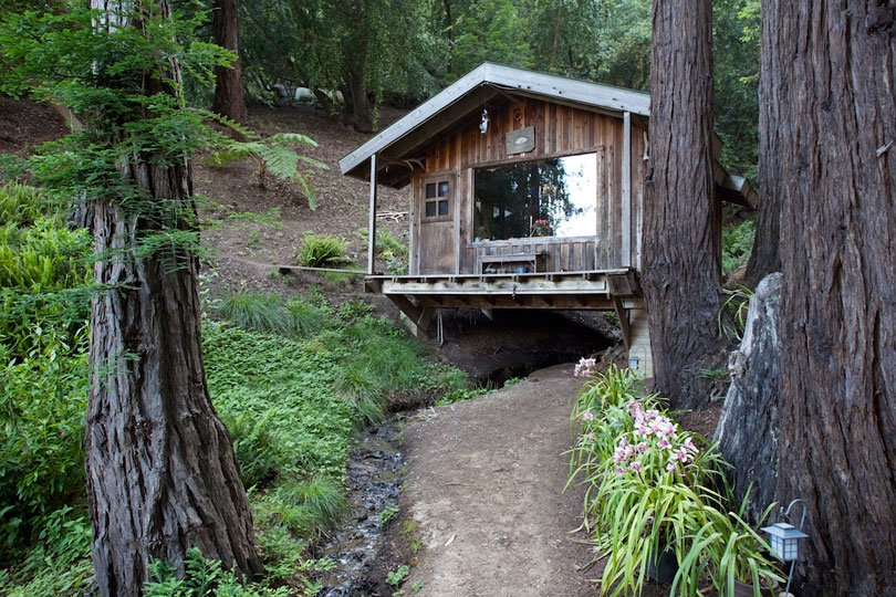 Cabin over a creek, 1980's.