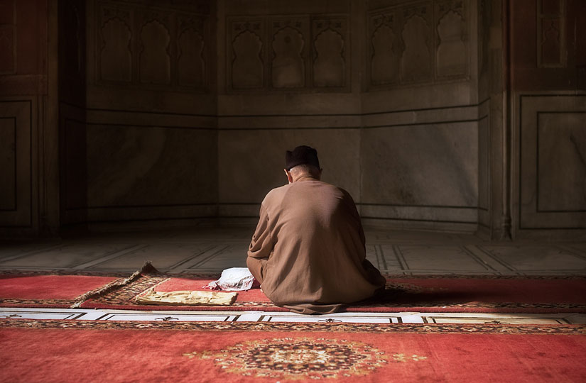 In the Prayer (Muslim gentleman on carpet) © William J Palank