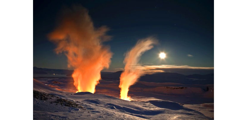 Steam rising from bore holes at Nesjavellir Geothermal Power Plant in Iceland