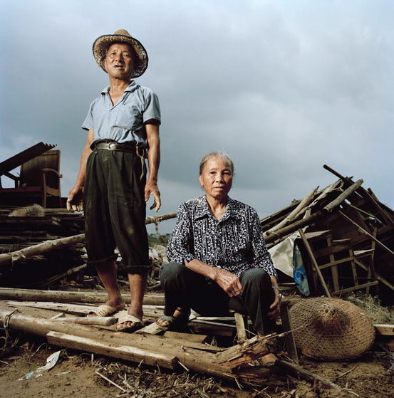 Yang Gengbao and Huang Lianfeng, shop owners. Hongse, Guangxi, China.