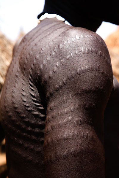 Ritual Body Scaring on Hunter, Near the Sudanese border, Ethiopia. © Andrew Geiger