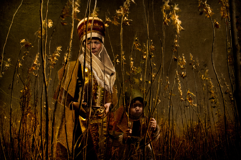 © Shola and Islam in a Field of Newly Planted Trees, 2010 by Cooper & Gorfer. An exhibition from The Hasselblad Foundation