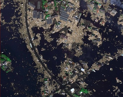 In this picture publicly provided by the German aerospace DLR and their crisis center on Monday March 14, 2011 the Japanese city of Sendai is pictured on Saturday March 12, 2011 after the earthquake and the following tsunami. (AP Photo/DLR ZKI)