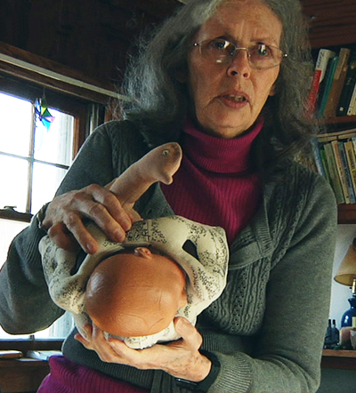 Ina May Gaskin explains a the Gaskin maneuver from <em>BIRTH STORY: Ina May Gaskin & The Farm Midwives</em> photo: Mary Wigmore 