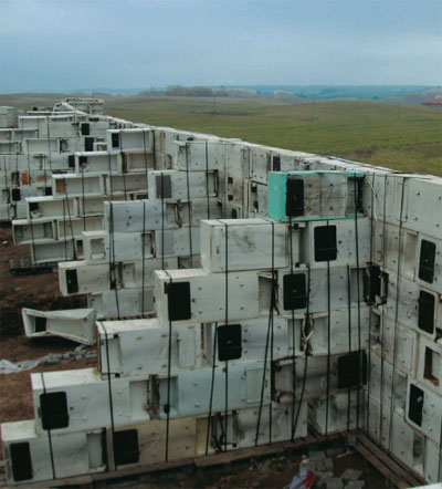 Return of the Fridges, Vilnius, Lithuania, 2007.  REFUNC.NL/Denis Oudendijk, Jan Korbes.  Property wall built from refrigerator carcasses.  